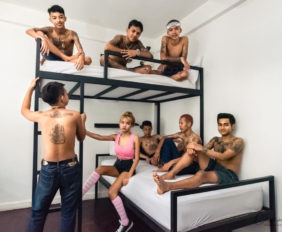 group of teen boys and one teen girl on bunkbeds