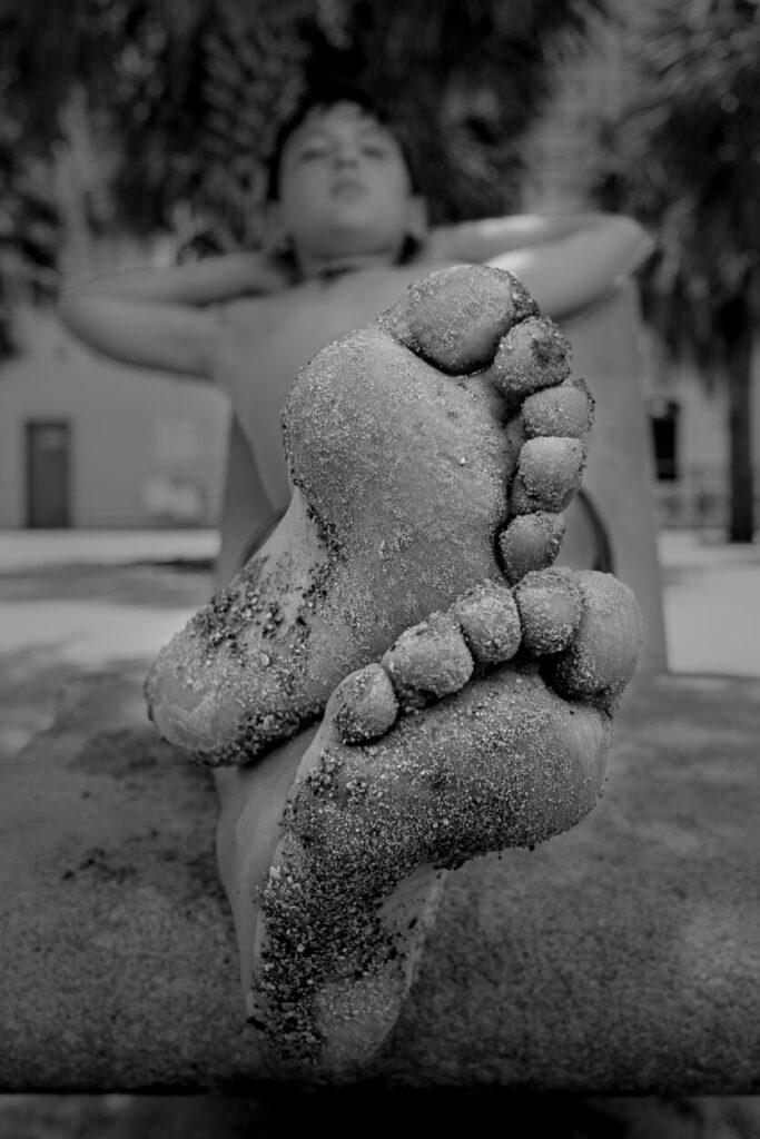 monochromatic child's grainy feet