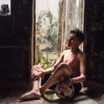 Barefoot and Shirtless Teen in Bogotá