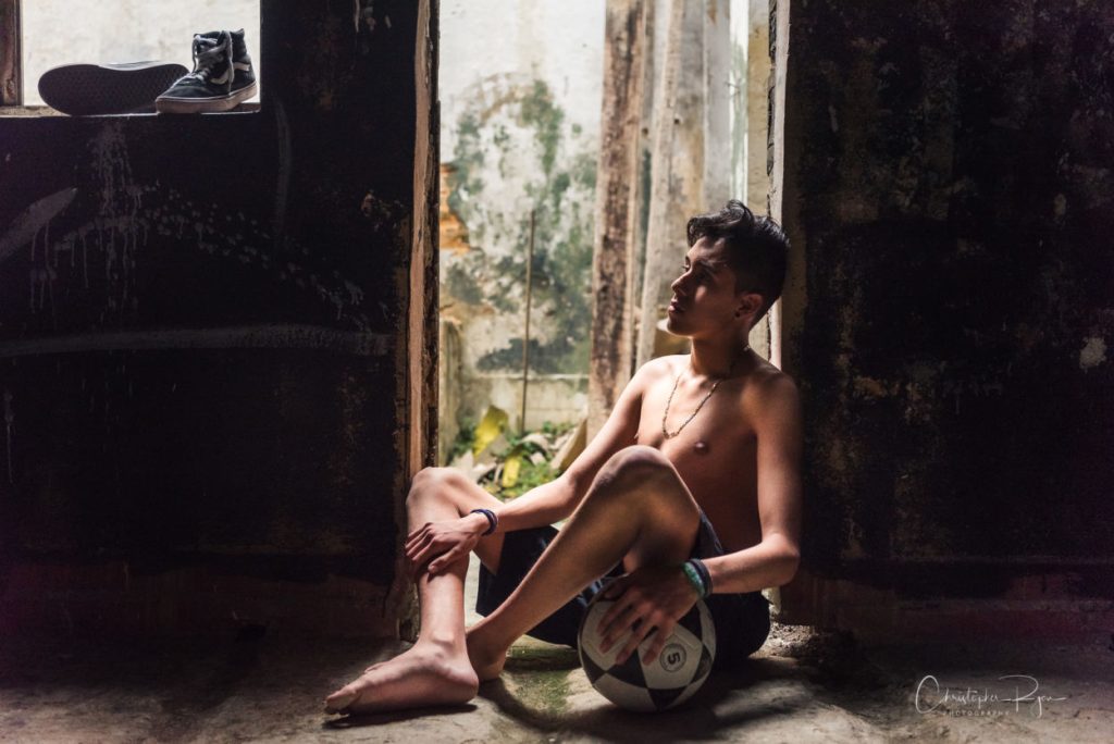 Barefoot and Shirtless Teen in Bogotá
